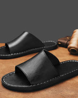 Black minimalist leather slide sandals