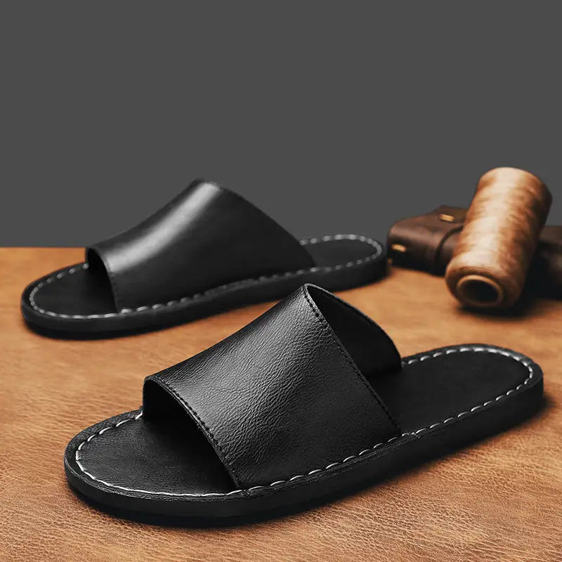 Black minimalist leather slide sandals